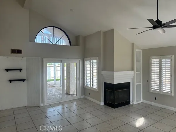 a view of livingroom with furniture and chandelier fan