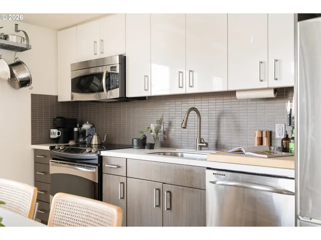 a living room with furniture and flowers
