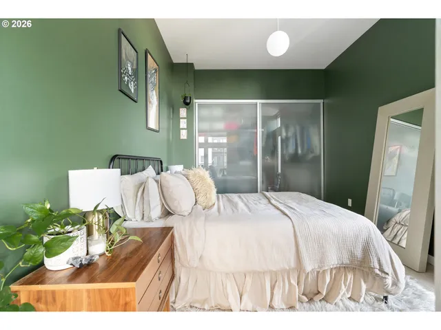 a bedroom with a bed and closet