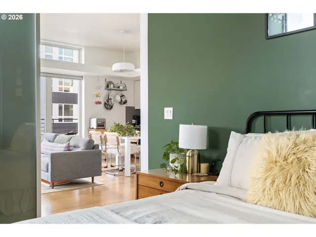 a living room with furniture and flowers