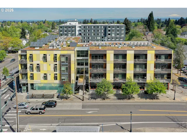 a view of outdoor space with cars parked