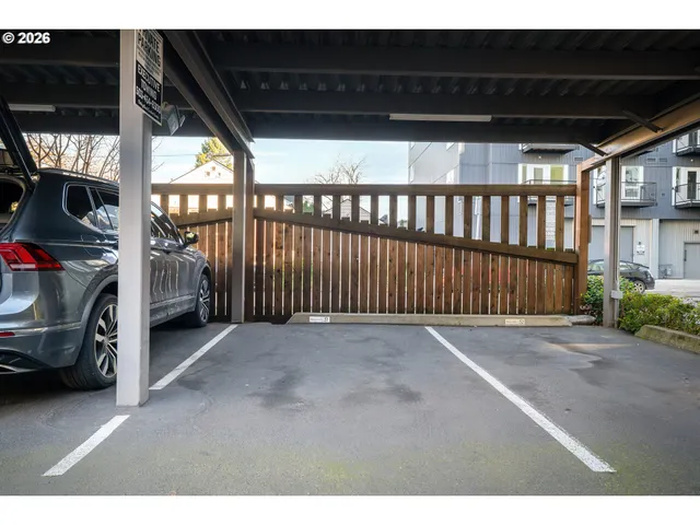 a view of a hallway with seating area