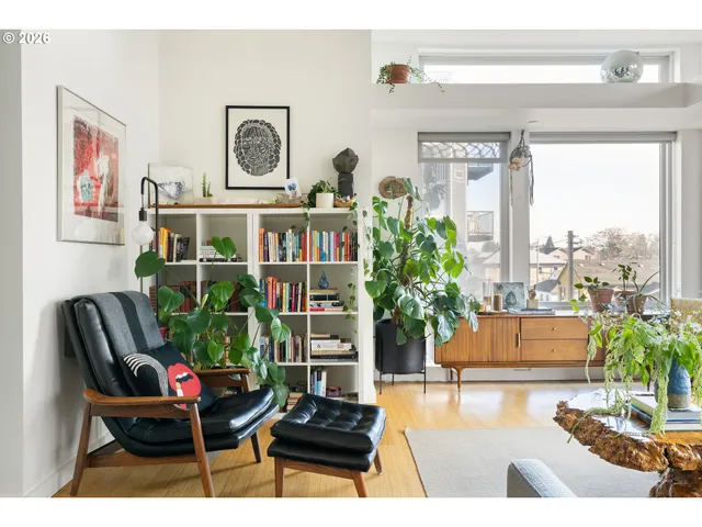 a view of a patio with table and chairs and potted plants