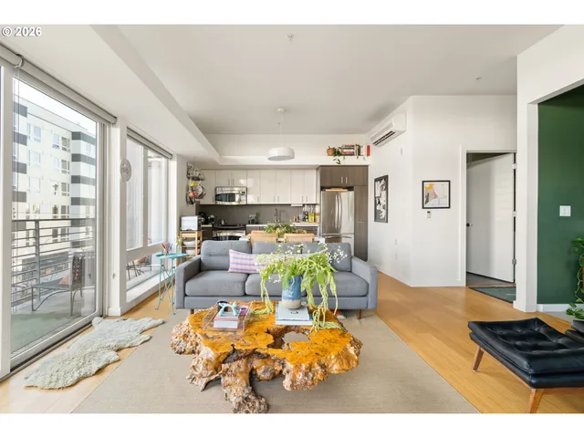 a kitchen with stainless steel appliances granite countertop a refrigerator a stove a sink and a refrigerator