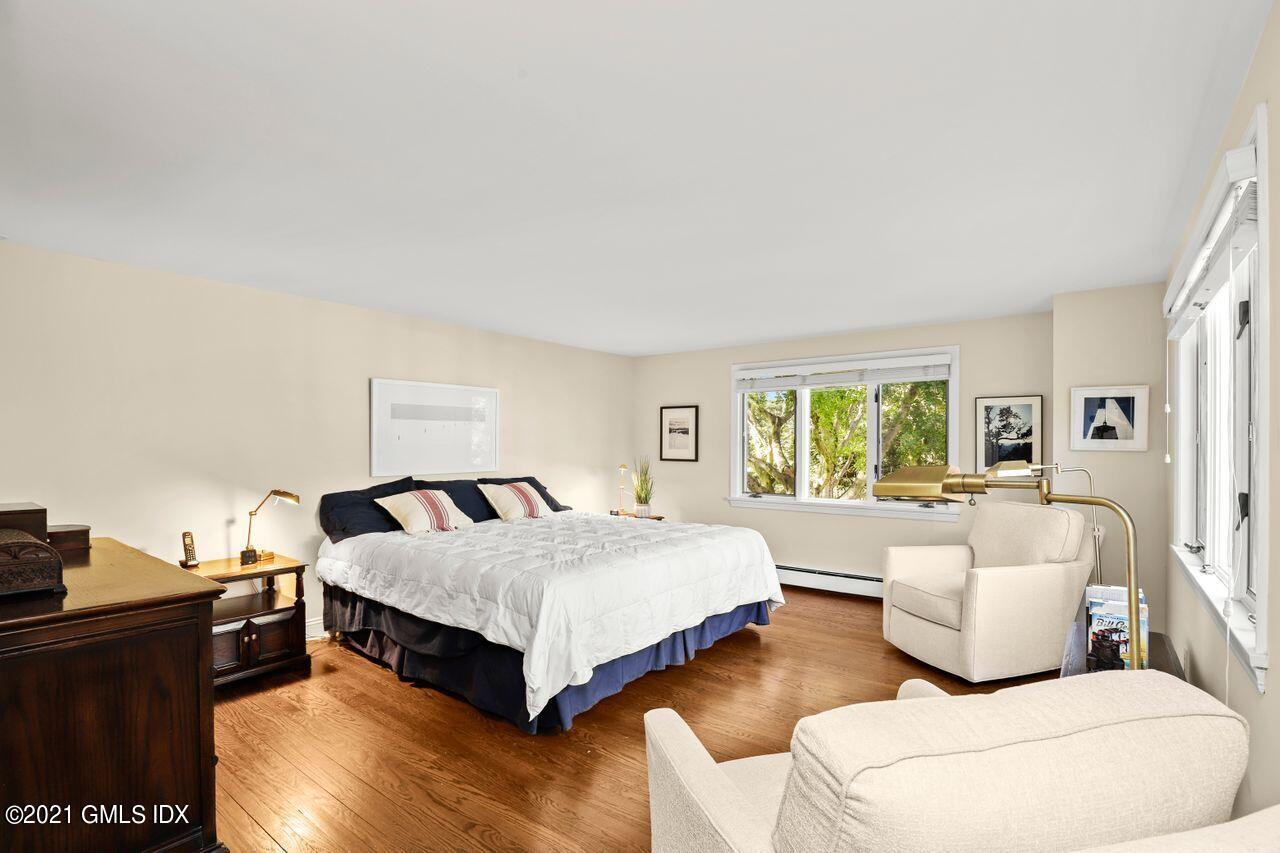 90 Winthrop Drive Riverside, CT 06878 - Photo 16 of 27 a spacious bedroom with a bed and a couch