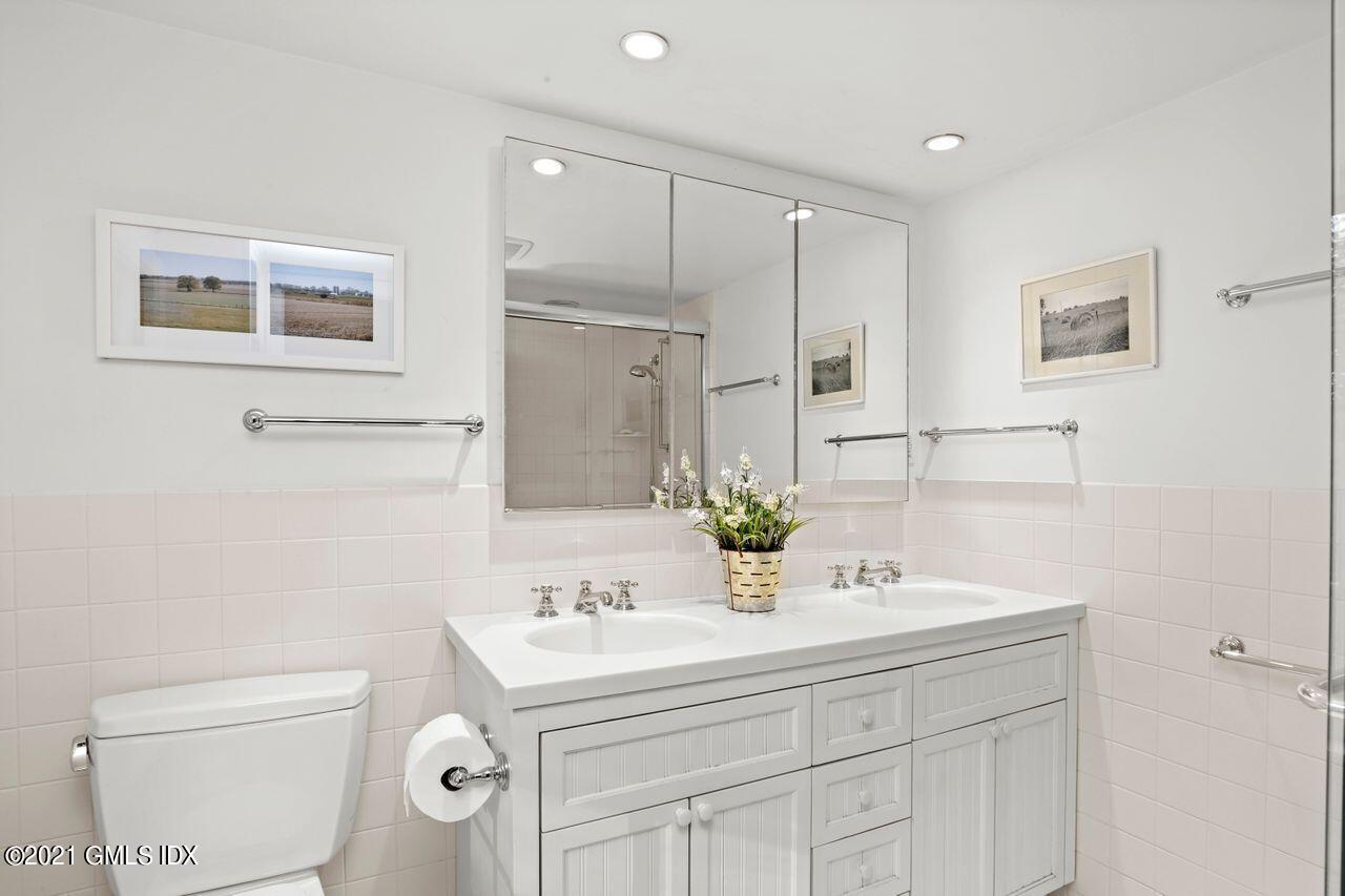 90 Winthrop Drive Riverside, CT 06878 - Photo 18 of 27 a bathroom with a sink toilet and shower