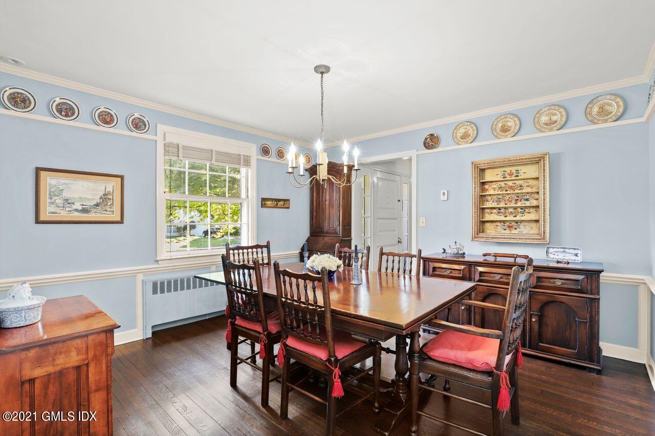 90 Winthrop Drive Riverside, CT 06878 - Photo 6 of 27 a dining room with furniture a chandelier and wooden floor