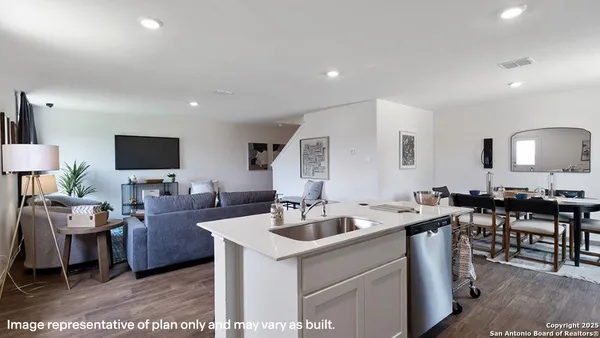a view of living room kitchen island stainless steel appliances living room and living room