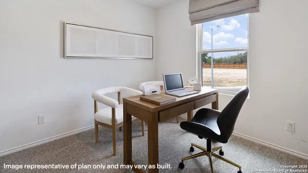 a view of a workspace with furniture