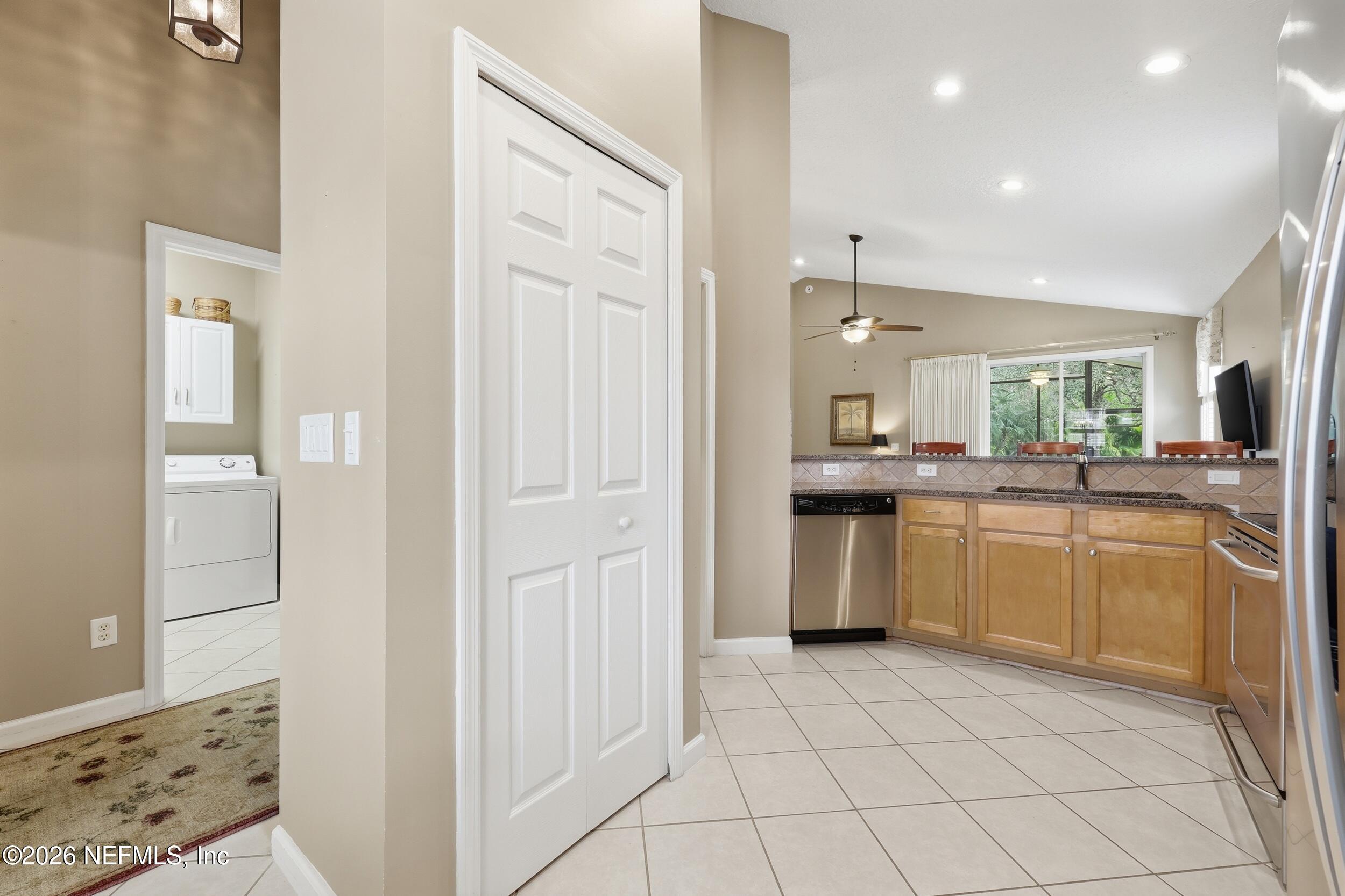 720 Copperhead Circle St. Augustine, FL 32092 - Photo 64 of 65 a kitchen with a refrigerator and a sink