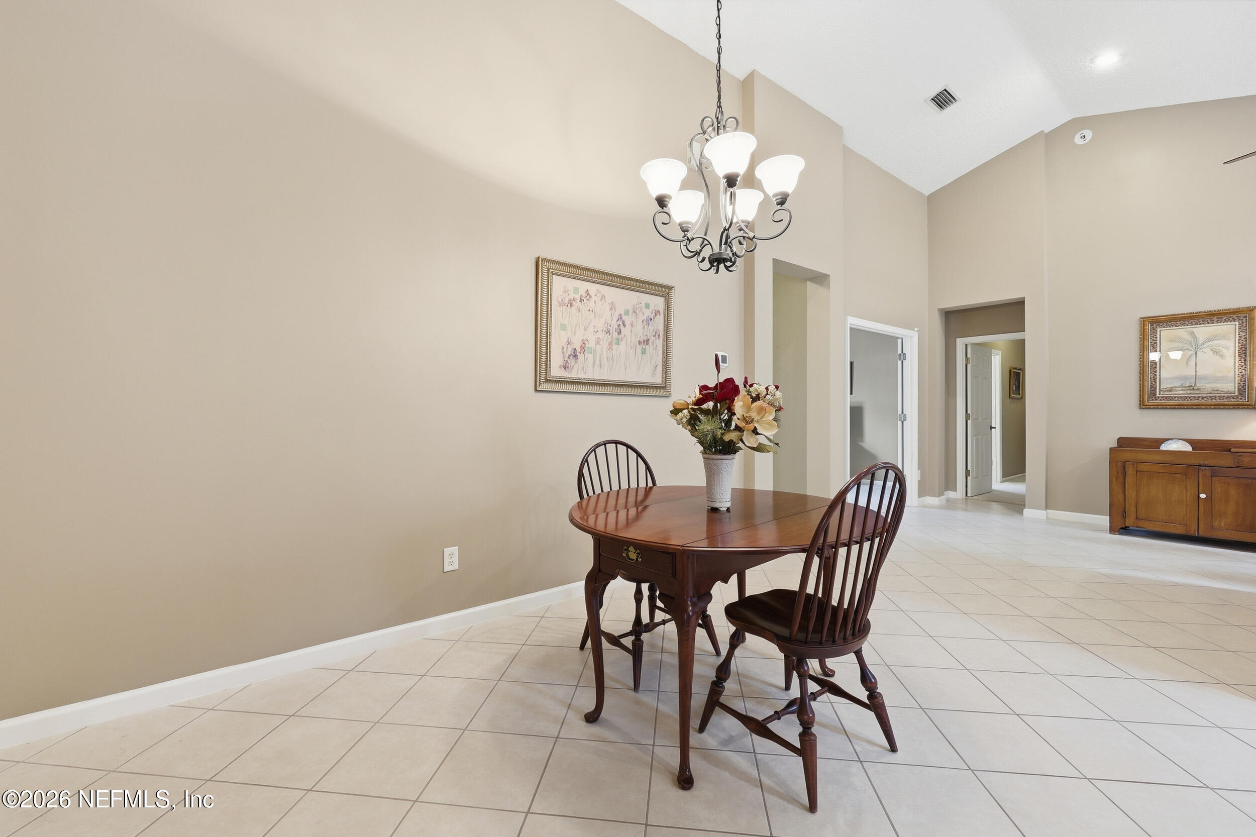 720 Copperhead Circle St. Augustine, FL 32092 - Photo 13 of 65 a view of a dining room with furniture and chandelier