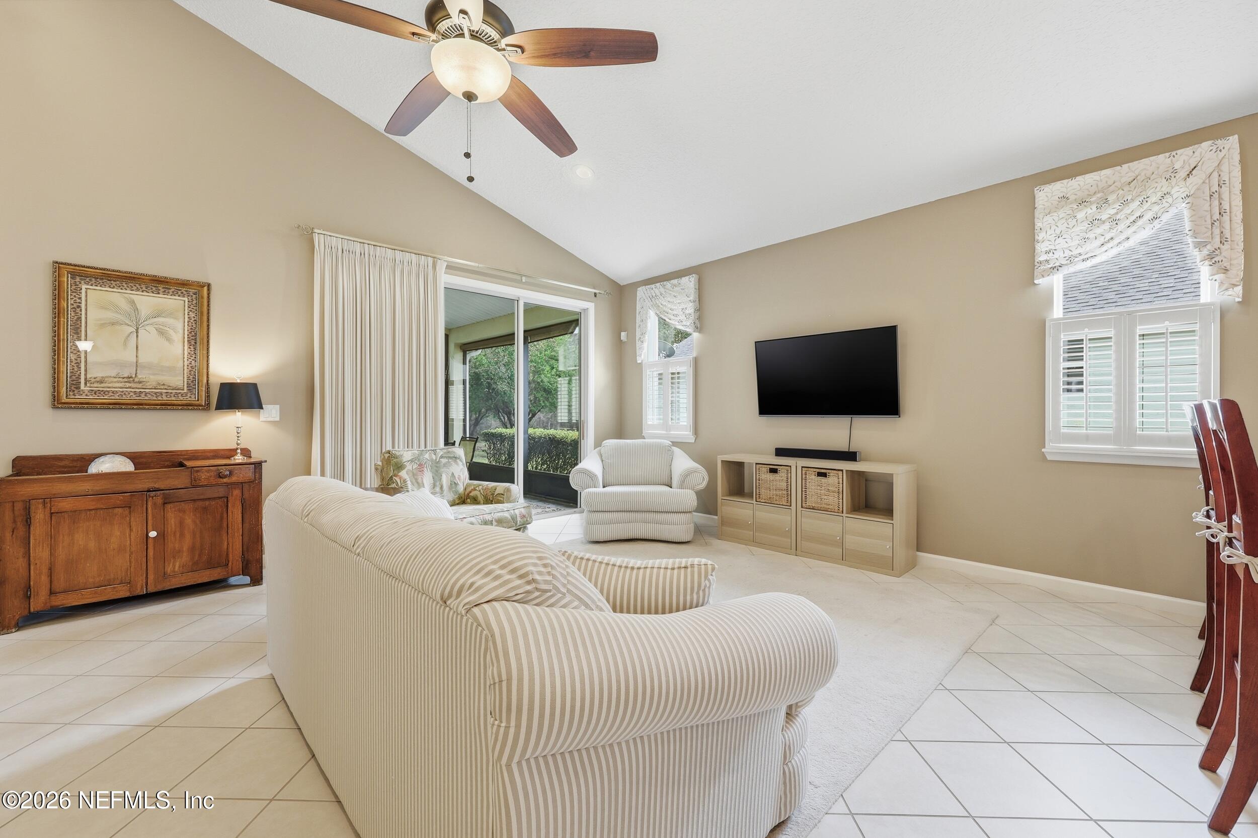 720 Copperhead Circle St. Augustine, FL 32092 - Photo 14 of 65 a living room with furniture and a flat screen tv