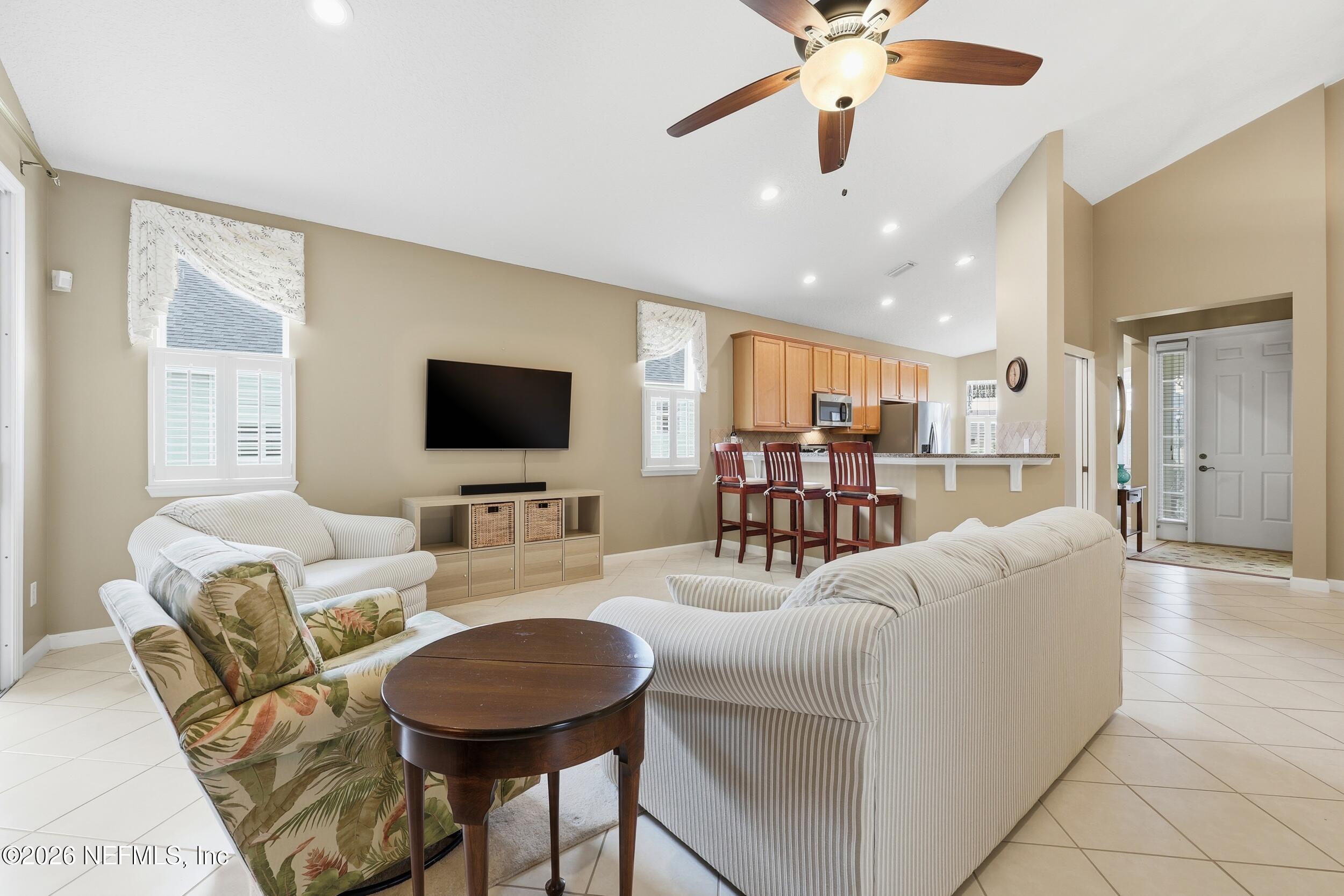 720 Copperhead Circle St. Augustine, FL 32092 - Photo 16 of 65 a living room with furniture and a flat screen tv