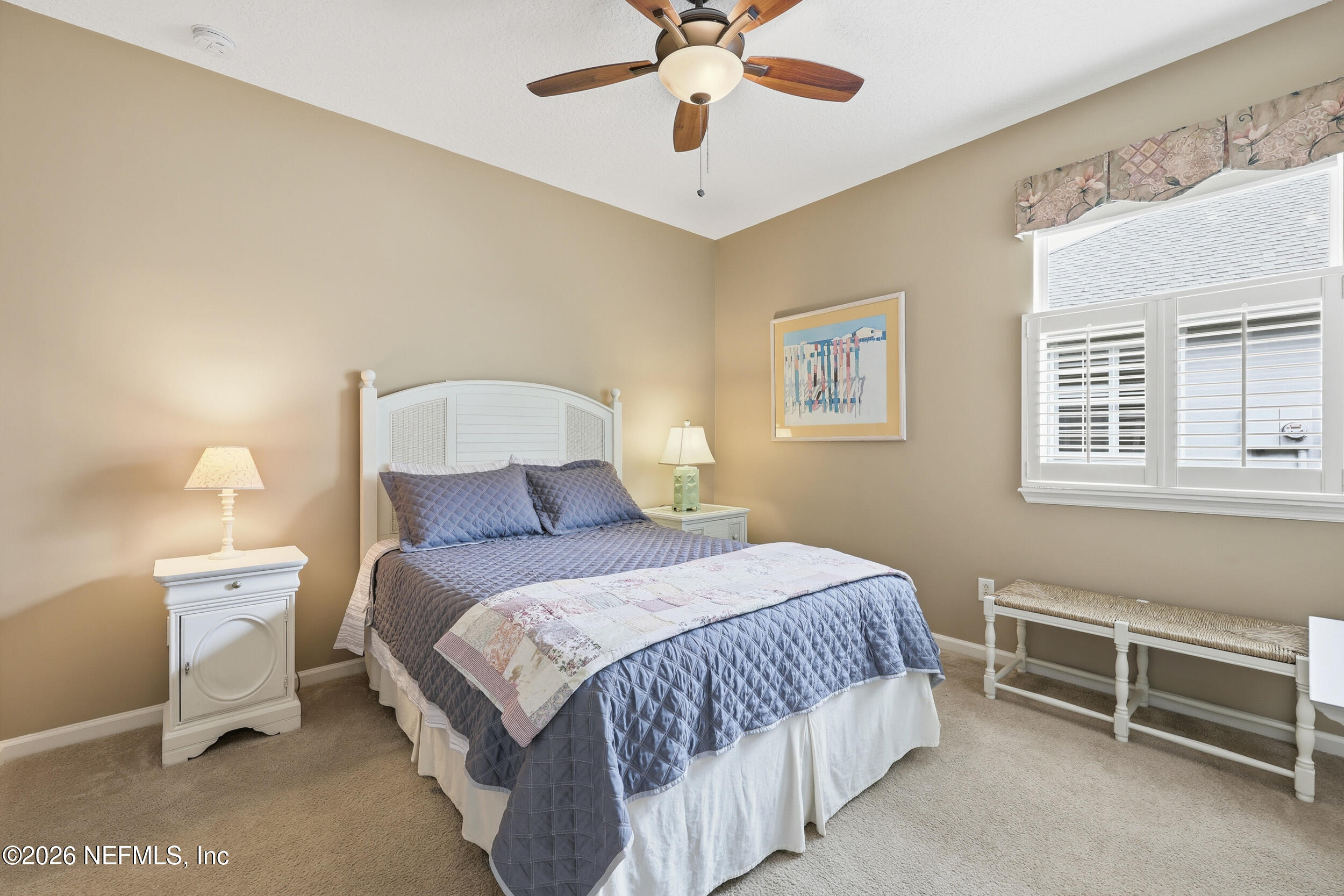 720 Copperhead Circle St. Augustine, FL 32092 - Photo 28 of 65 a bedroom with a bed and a chandelier