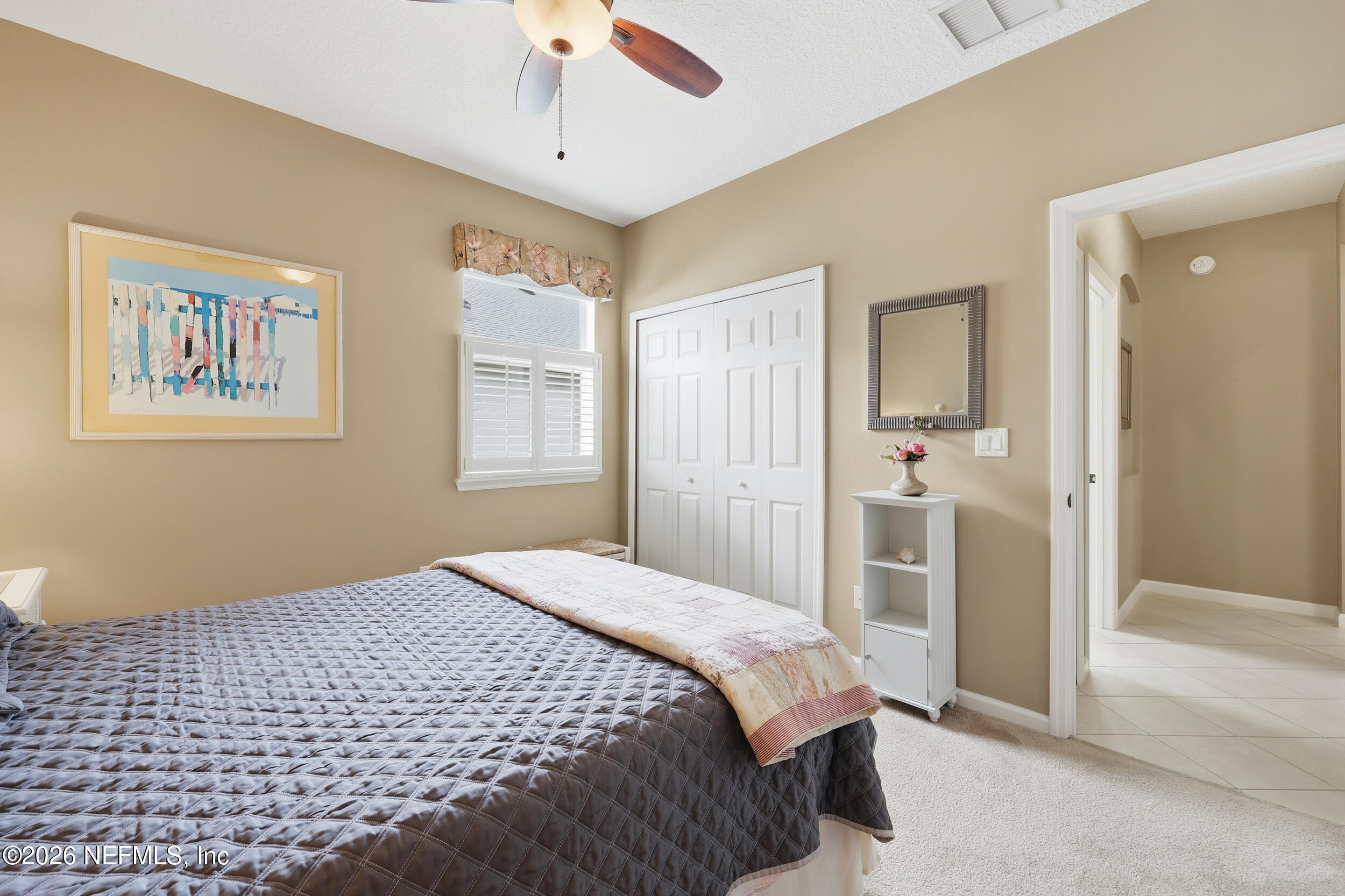 720 Copperhead Circle St. Augustine, FL 32092 - Photo 29 of 65 a bedroom with a bed and a window
