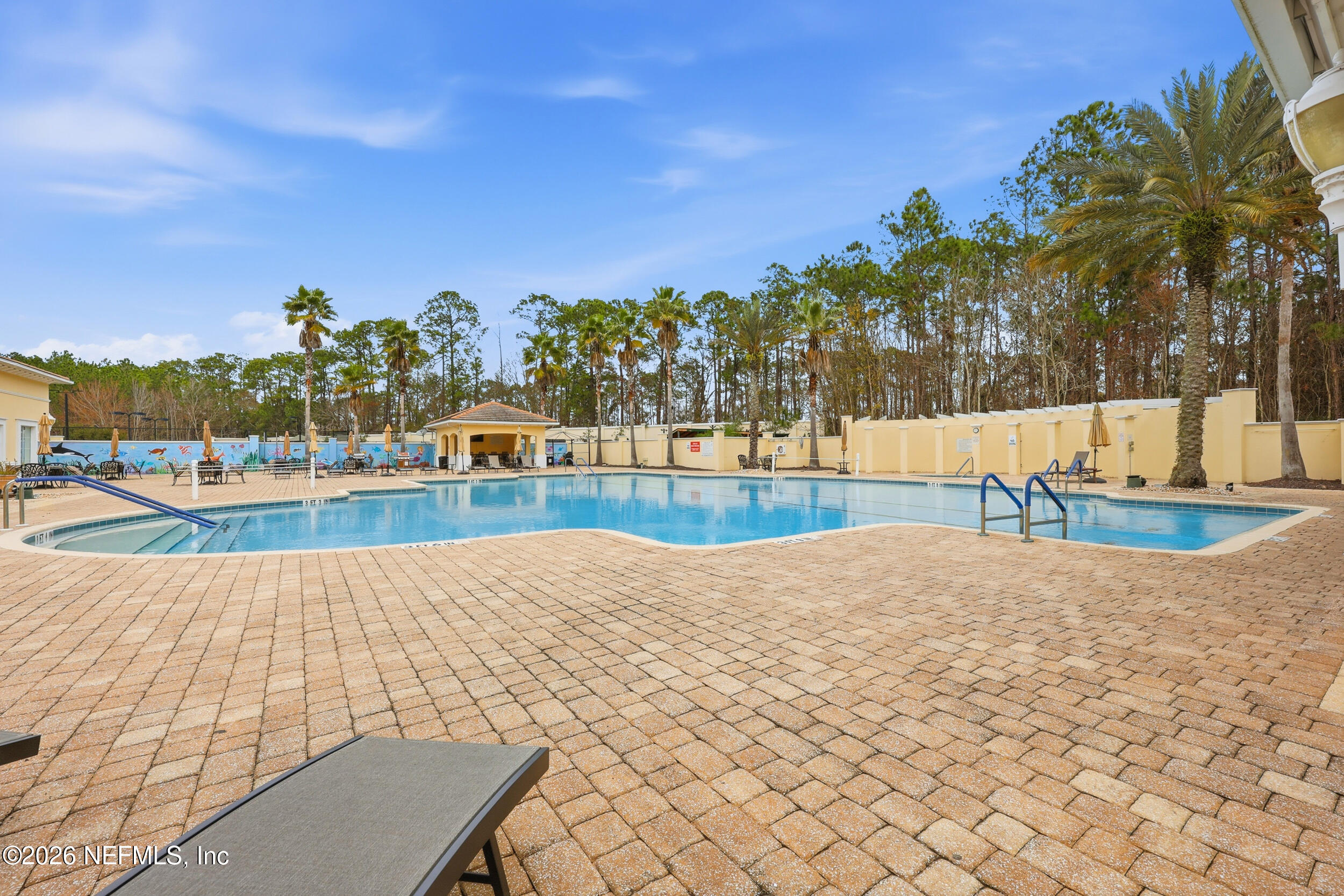 720 Copperhead Circle St. Augustine, FL 32092 - Photo 55 of 65 a view of a swimming pool and an outdoor seating