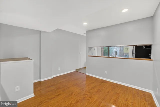 a kitchen with stainless steel appliances granite countertop a refrigerator and a stove
