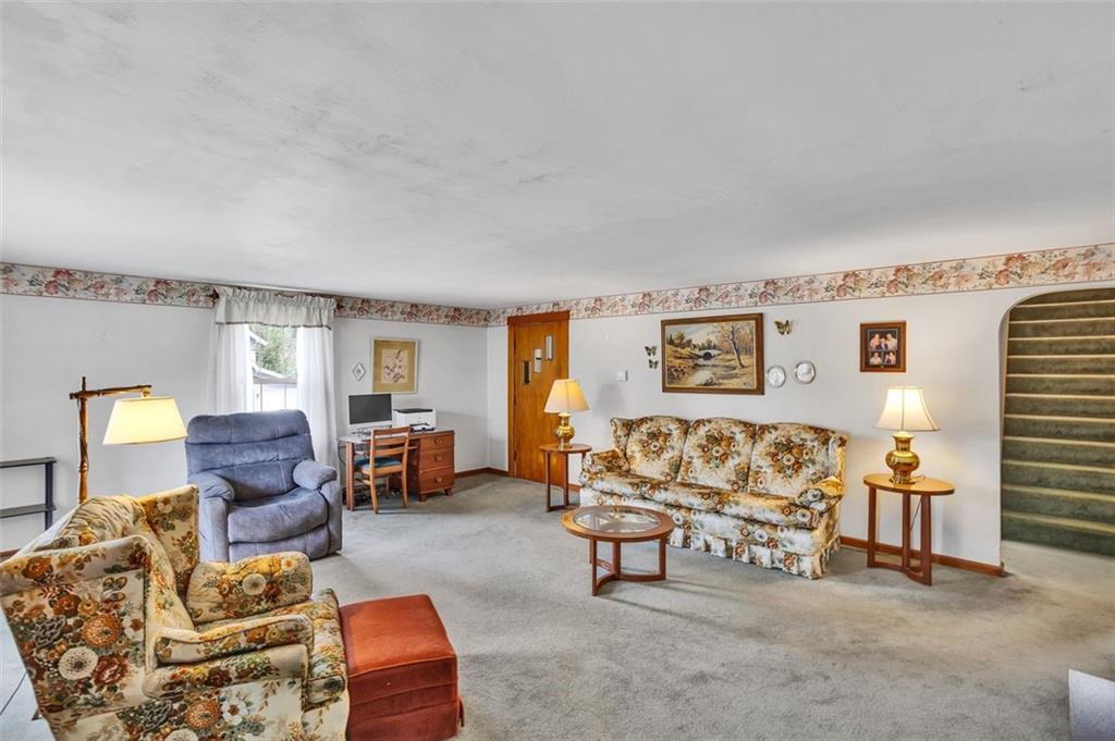 613 Portersville Road Ellwood City, PA 16117 - Photo 5 of 23 Large living room has space for many furniture combinations.