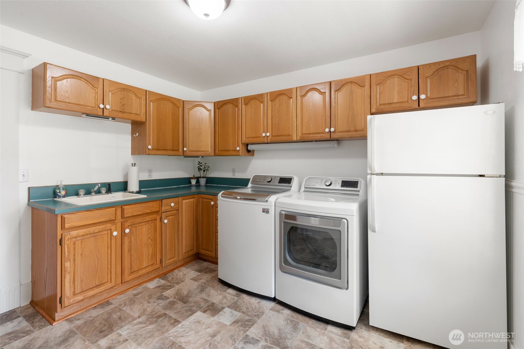 308 Brockway Road Chehalis, WA 98532 - Photo 30 of 40 a kitchen with stainless steel appliances granite countertop a refrigerator sink stove and cabinets