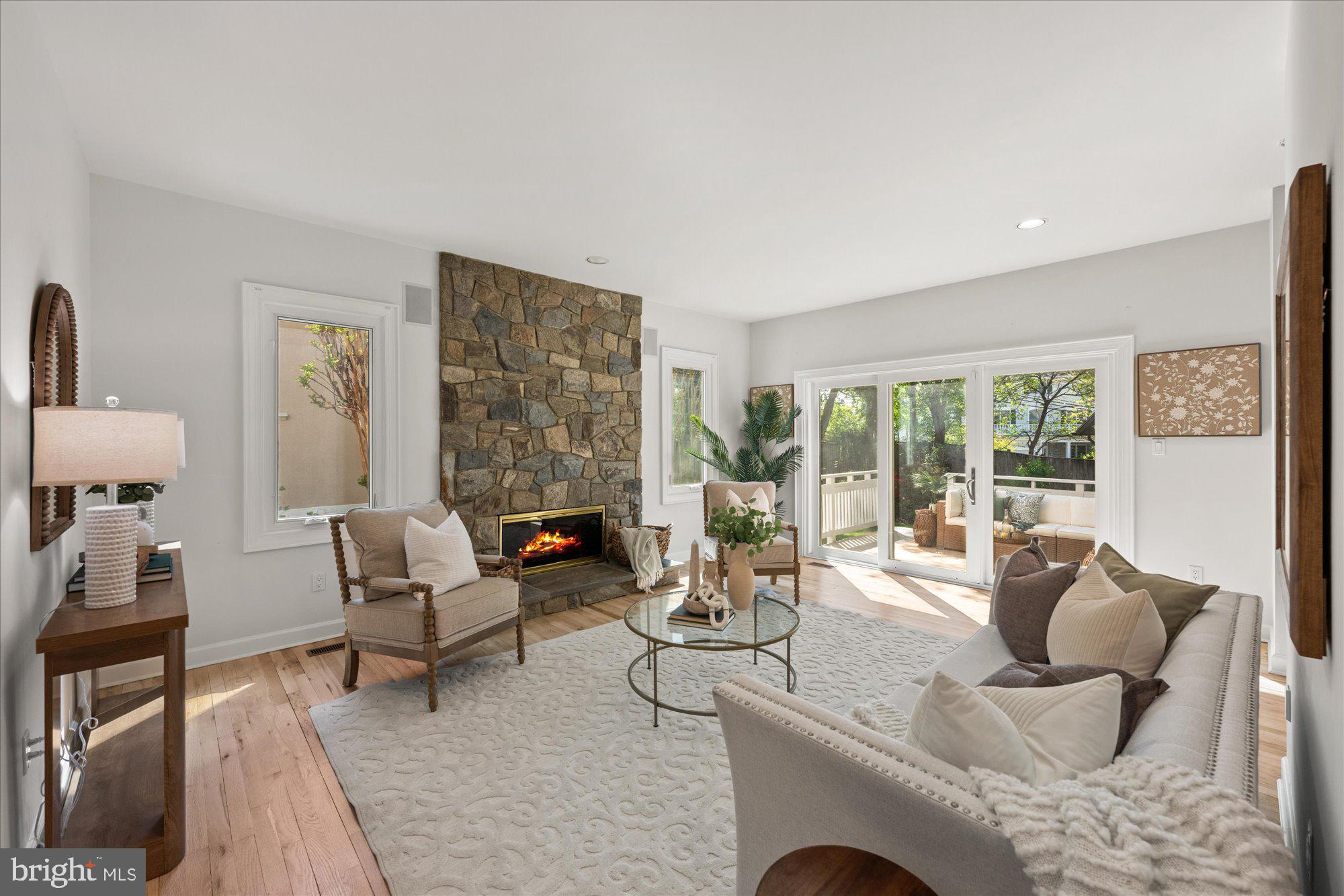4332 Sangamore Road Bethesda, MD 20816 - Photo 11 of 28 Cozy living space with stone fireplace.