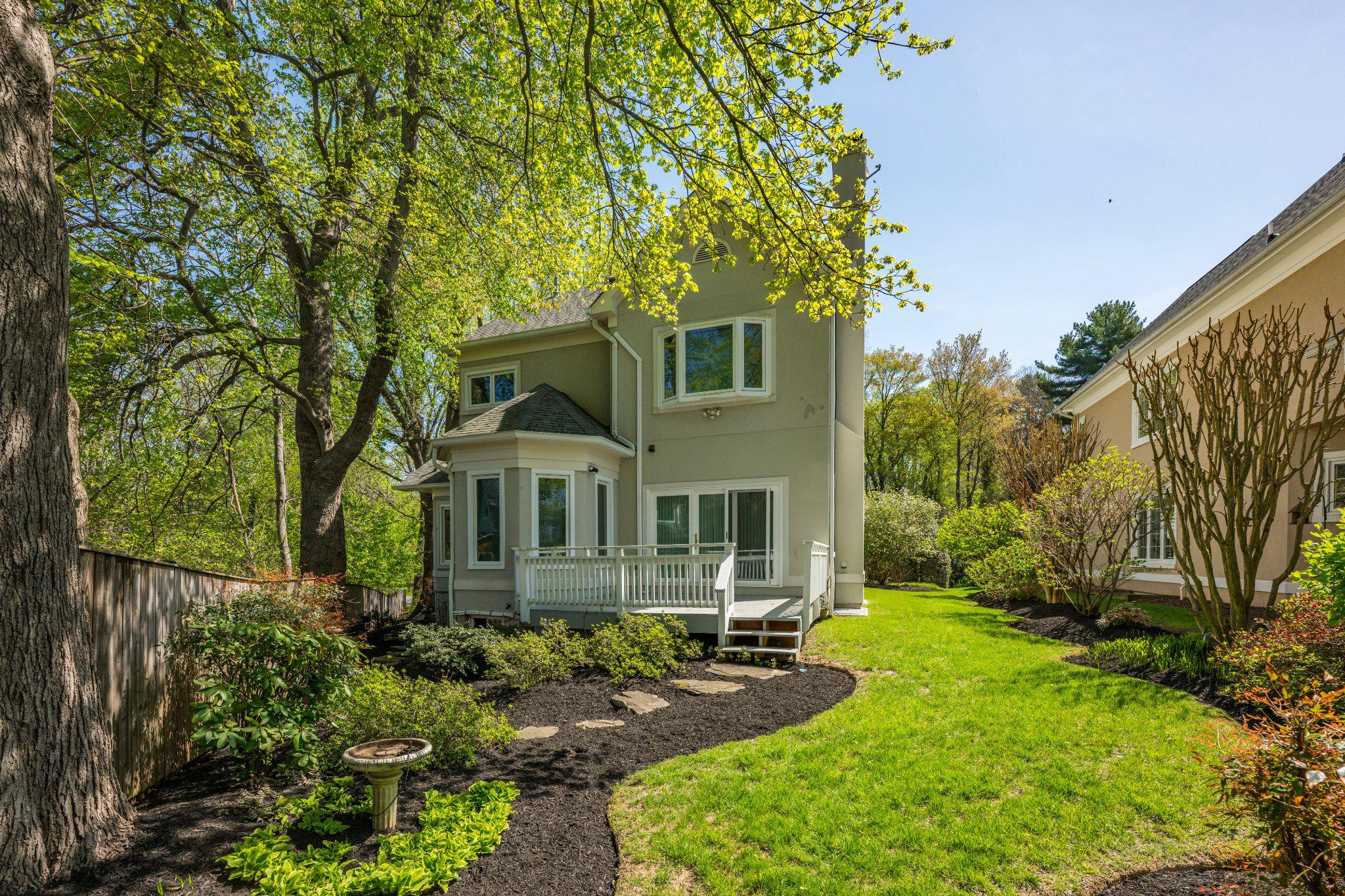 4332 Sangamore Road Bethesda, MD 20816 - Photo 3 of 28 Exterior of home nestled in lush greenery.