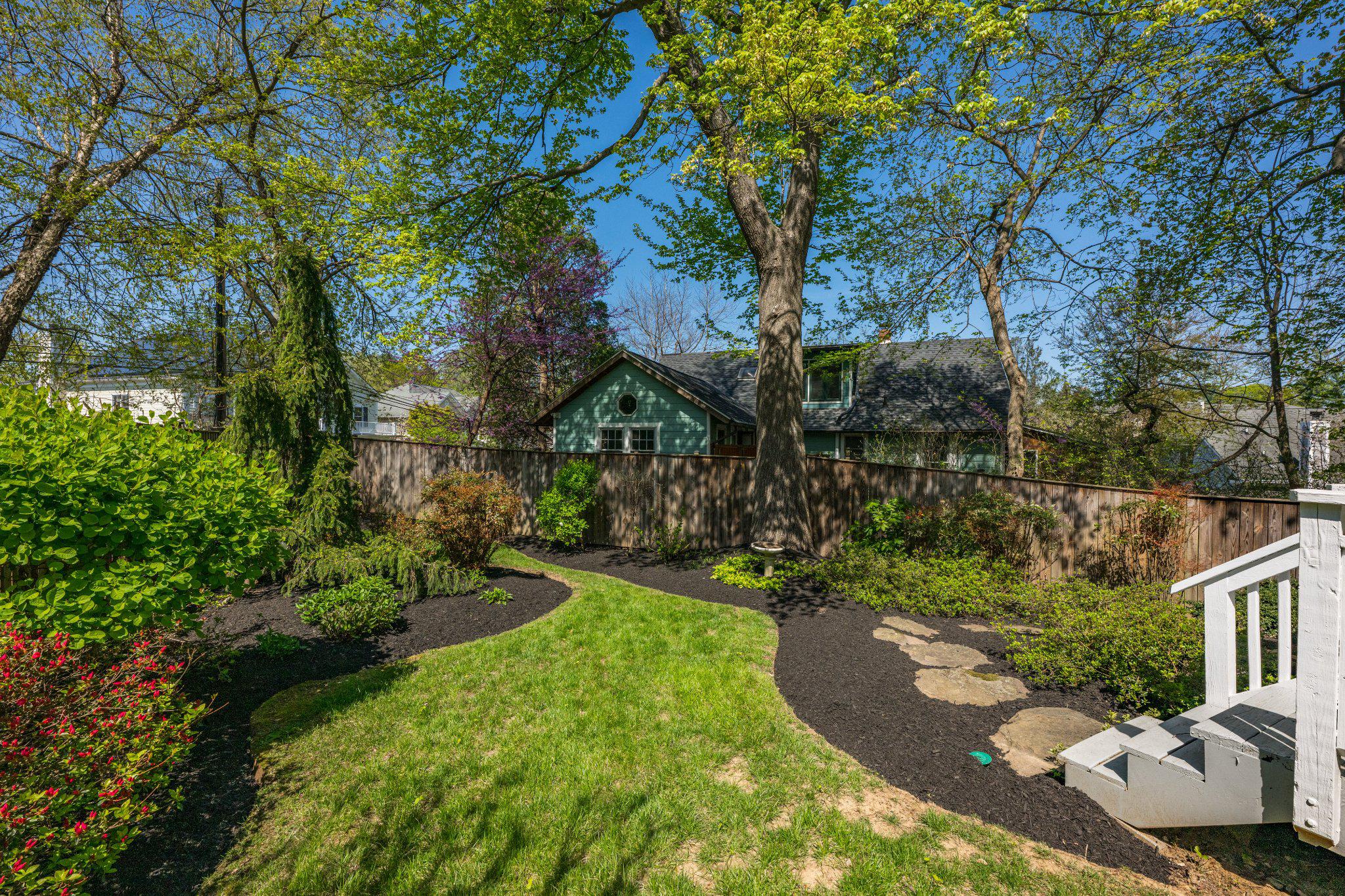 4332 Sangamore Road Bethesda, MD 20816 - Photo 4 of 28 Lush backyard oasis with vibrant greenery.