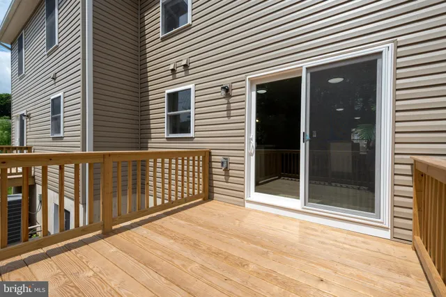 a view of a balcony with wooden floor