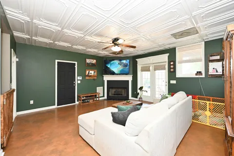 a living room with furniture and a fireplace