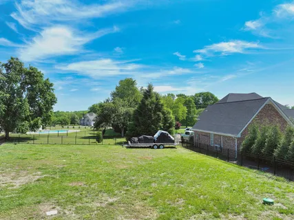 a view of a house with a big yard