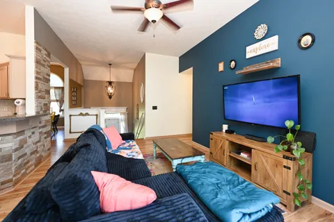 a living room with furniture and a flat screen tv