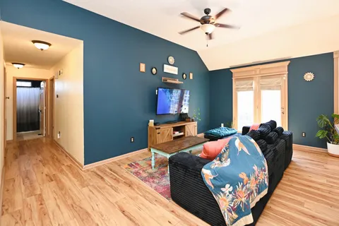a bedroom with furniture and a chandelier