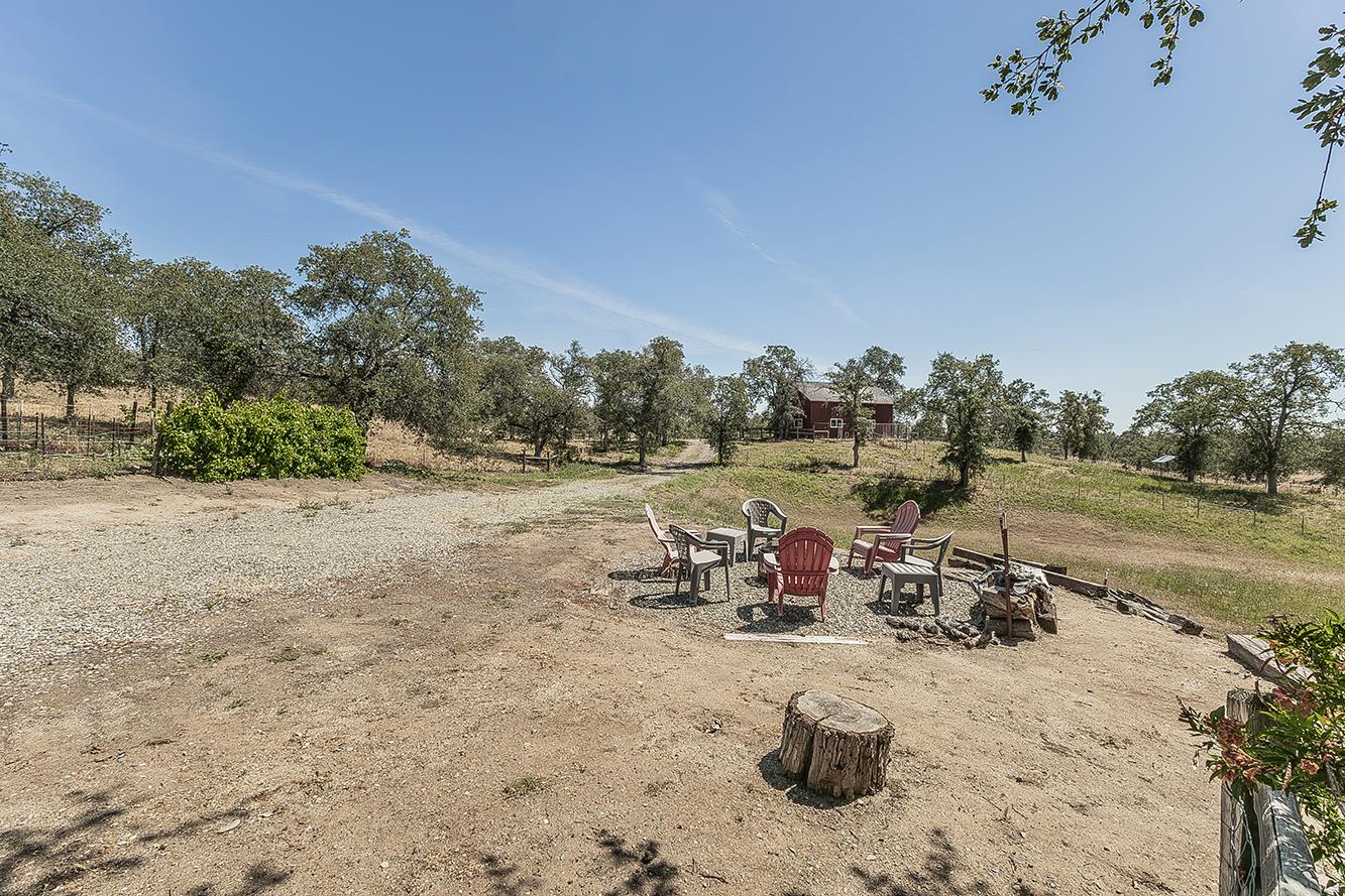 14815 Garlock Lane Prather, CA 93651 - Photo 8 of 80 a view of a lake with a table and chairs