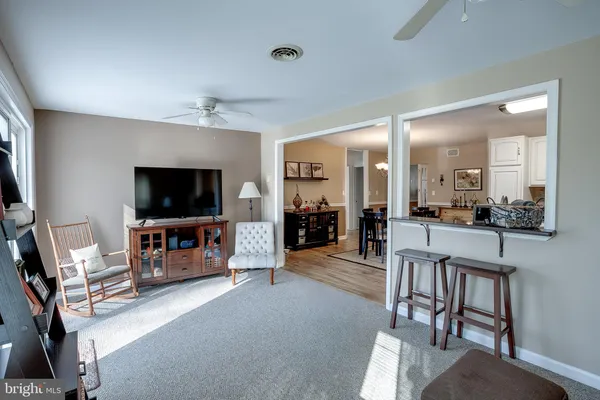 a view of a livingroom with furniture and a flat screen tv
