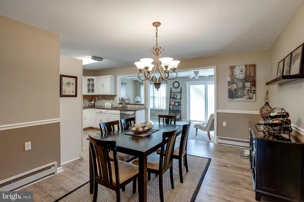 a dining room with furniture and window