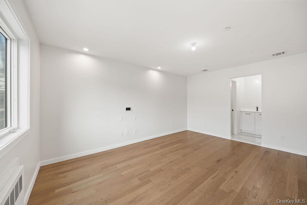 62 Blauvelt Road, Unit 202 Monsey, NY 10952 - Photo 21 of 34 a view of empty room with wooden floor and fan
