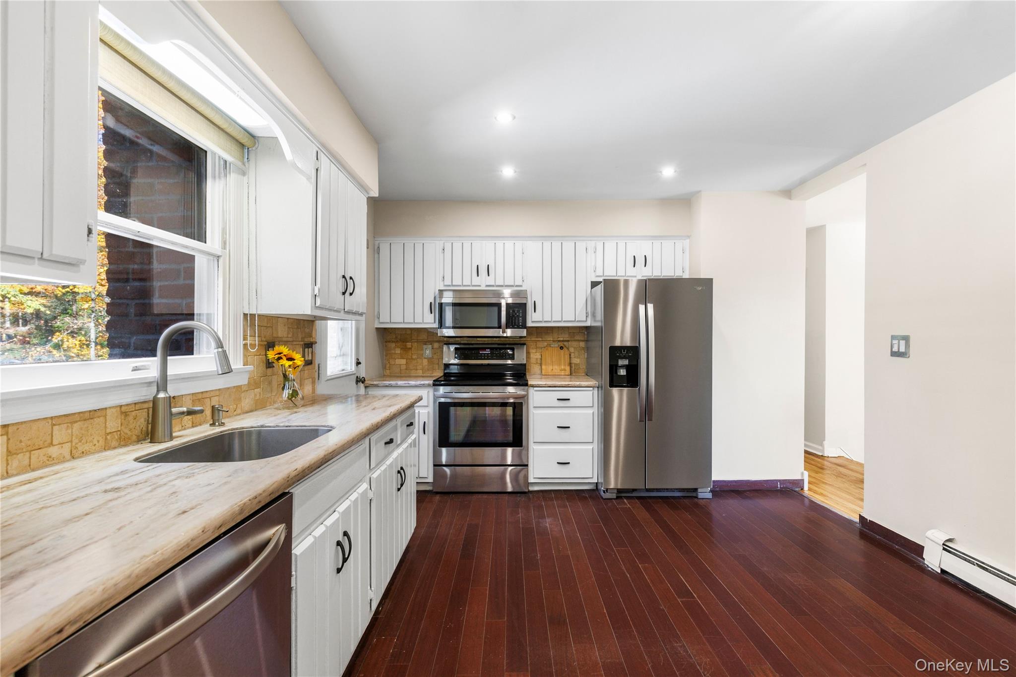 610 Granite Springs Road Yorktown Heights, NY 10598 - Photo 13 of 34 a kitchen with granite countertop a sink cabinets and stainless steel appliances
