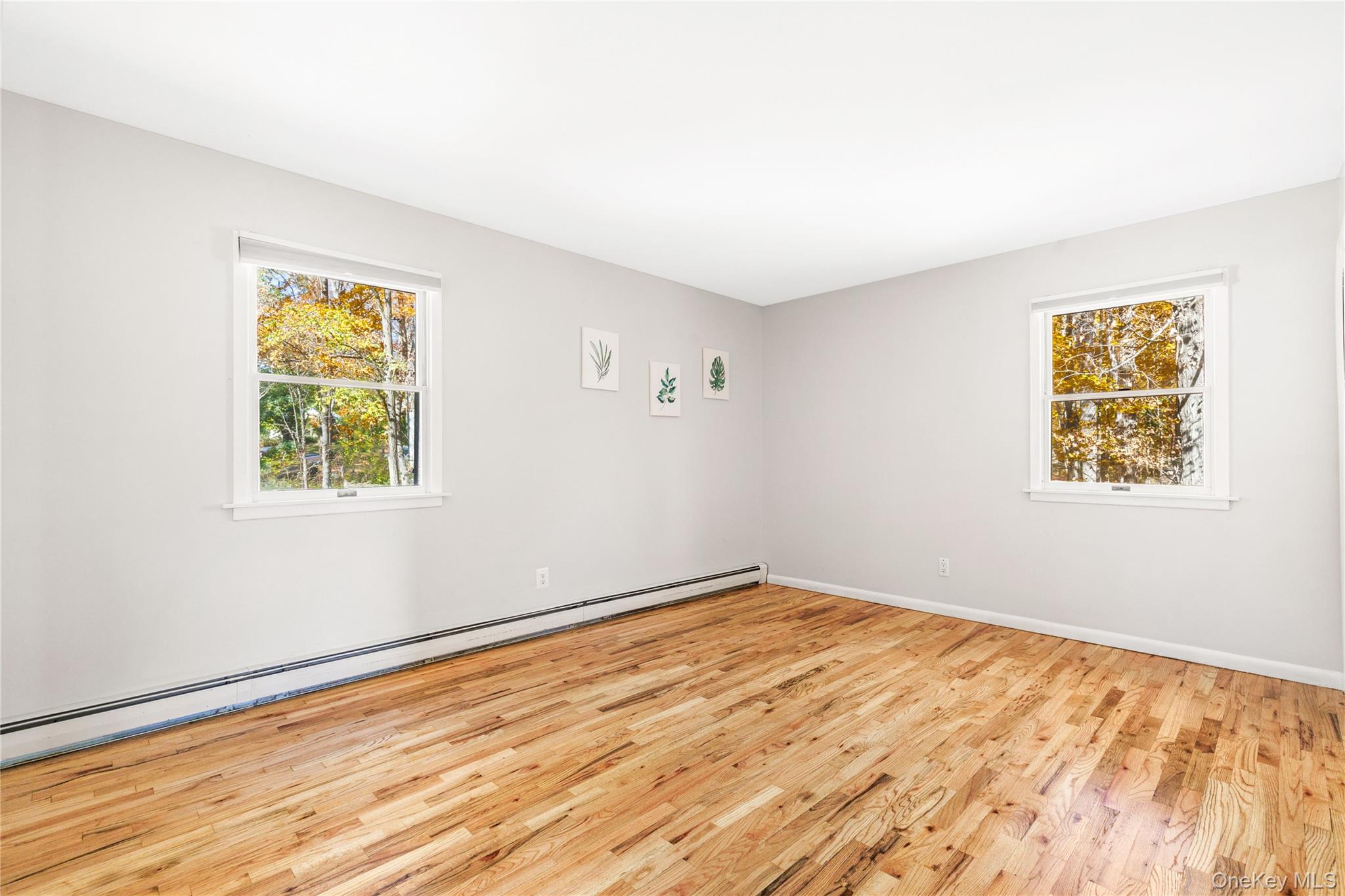 610 Granite Springs Road Yorktown Heights, NY 10598 - Photo 15 of 34 a view of empty room with wooden floor and fan
