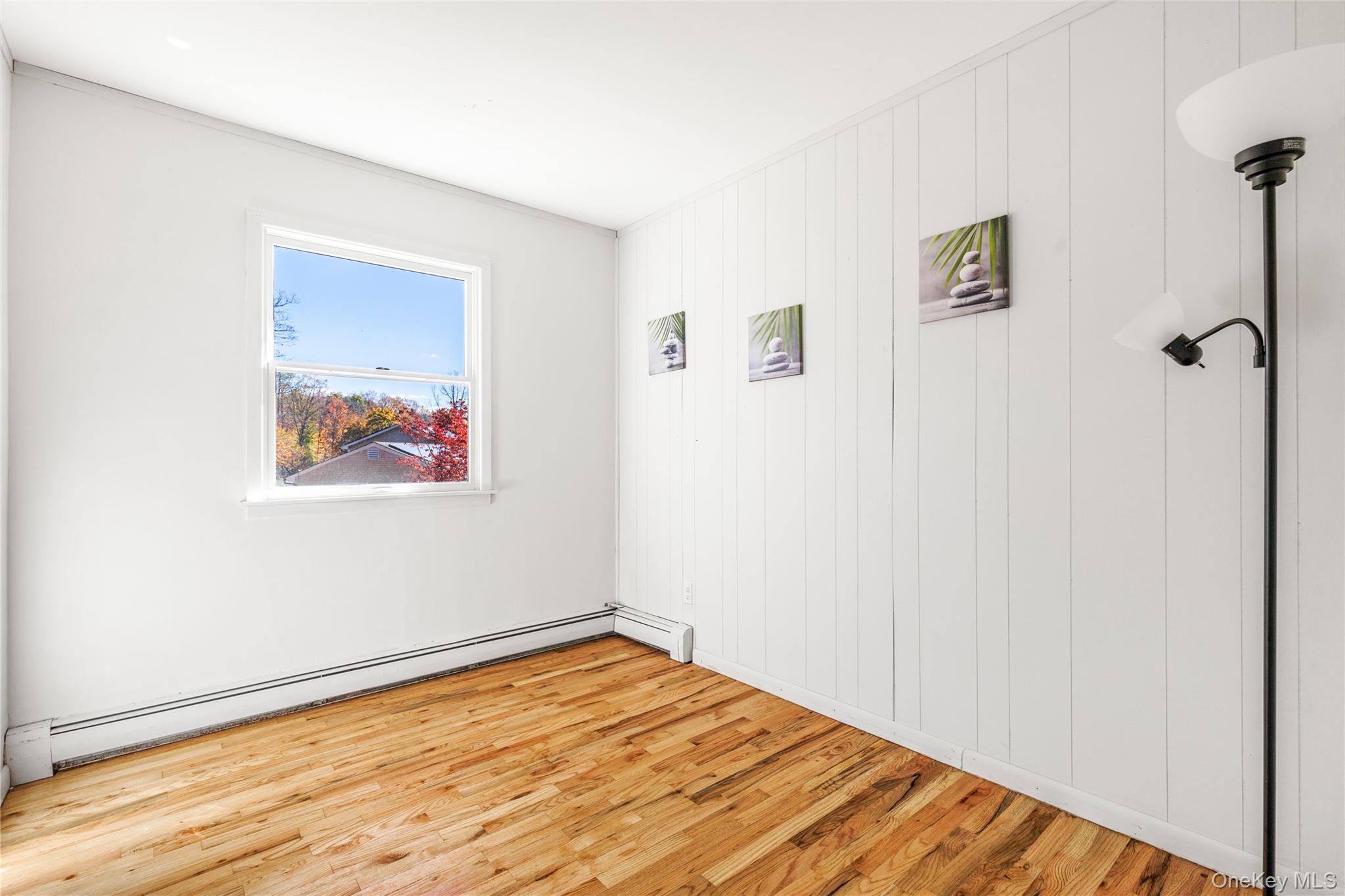 610 Granite Springs Road Yorktown Heights, NY 10598 - Photo 18 of 34 a view of a room with wooden floor and wall painting