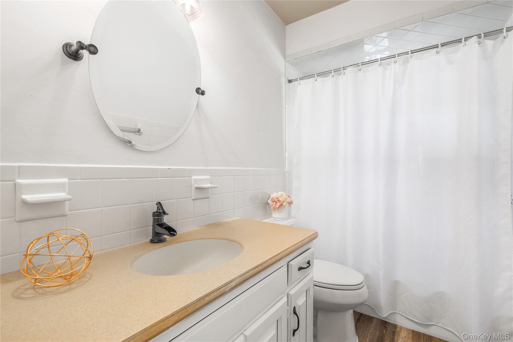 610 Granite Springs Road Yorktown Heights, NY 10598 - Photo 19 of 34 a bathroom with a sink a toilet and a mirror
