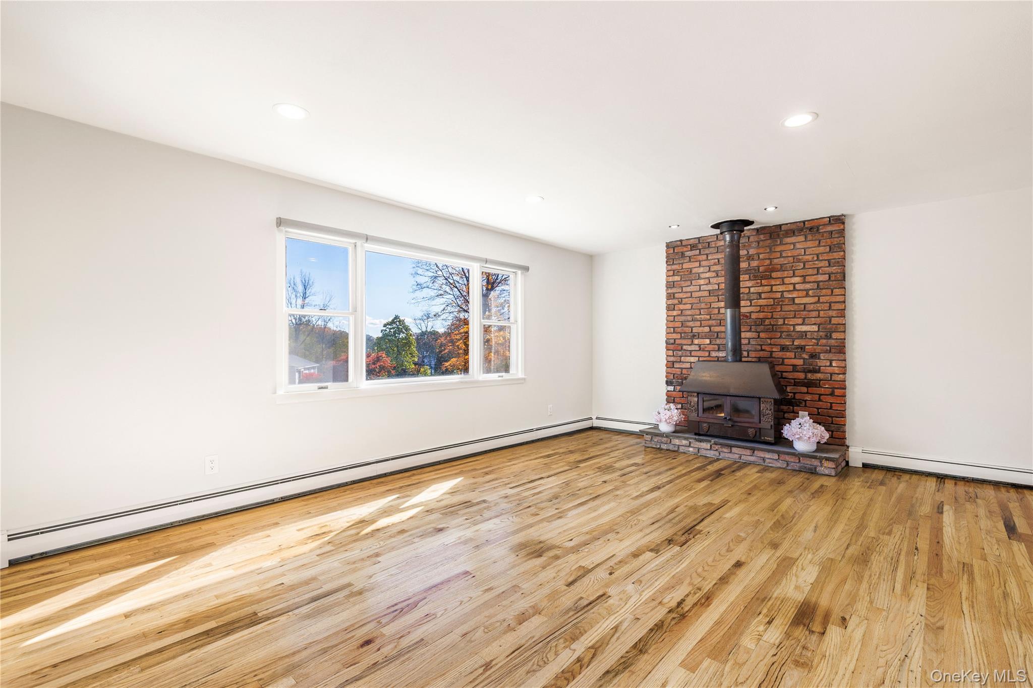 610 Granite Springs Road Yorktown Heights, NY 10598 - Photo 3 of 34 wooden floor in an empty room with a window