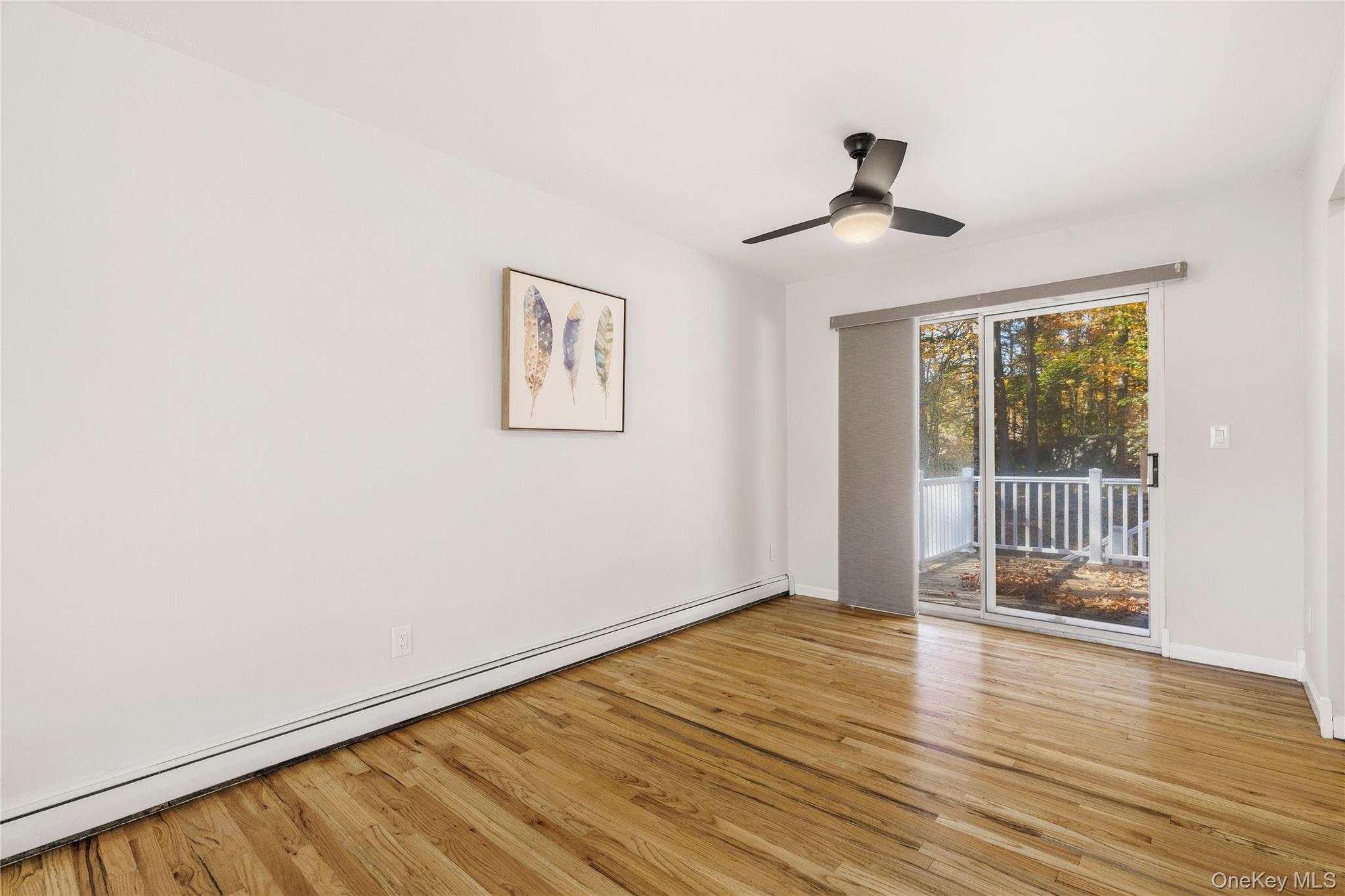 610 Granite Springs Road Yorktown Heights, NY 10598 - Photo 9 of 34 a view of an empty room with wooden floor and a window