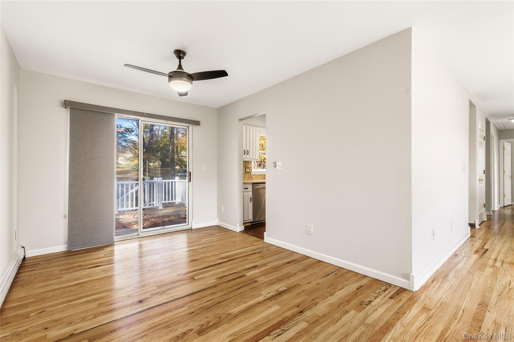 610 Granite Springs Road Yorktown Heights, NY 10598 - Photo 10 of 34 a view of an empty room with wooden floor and a window