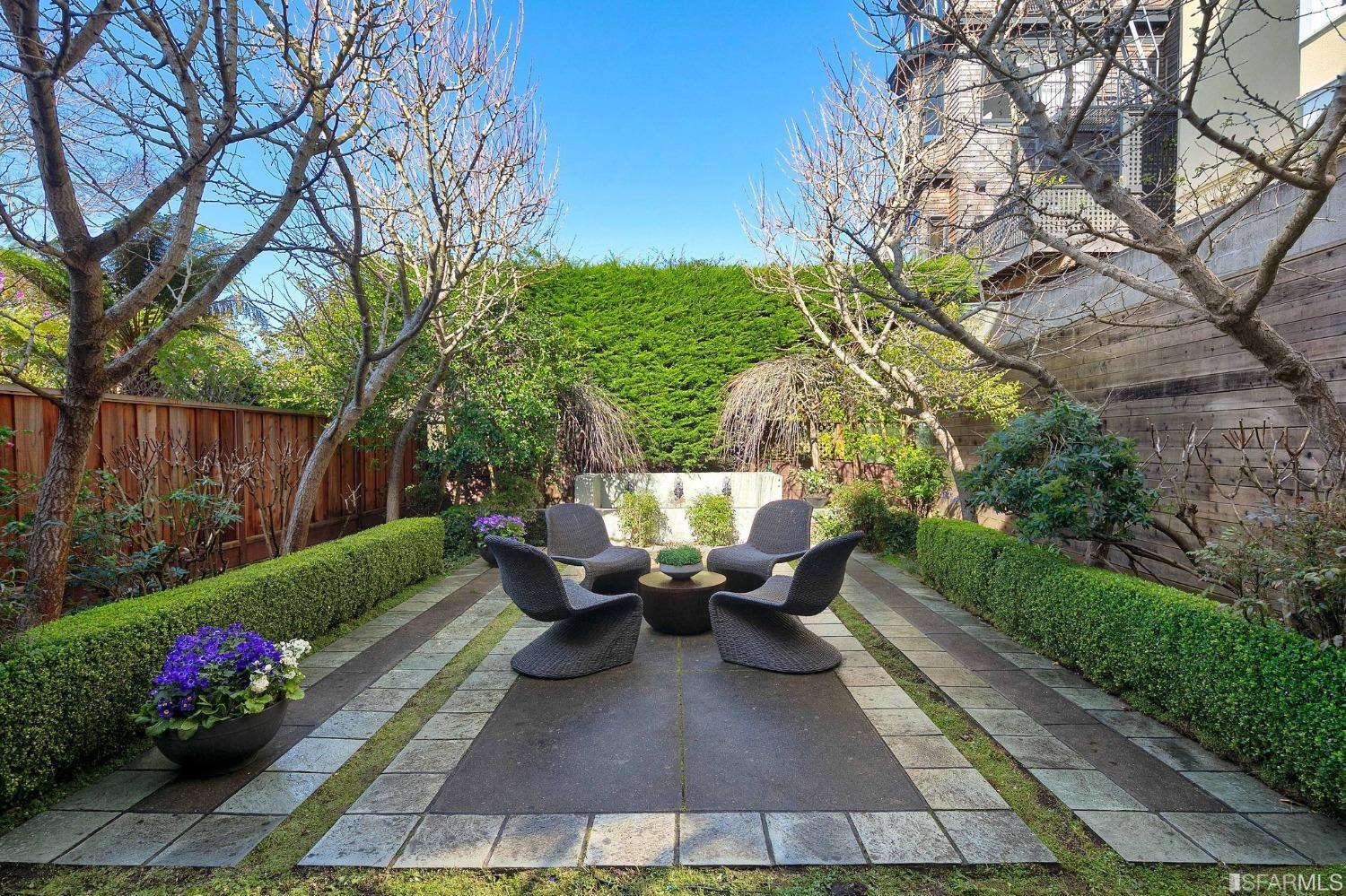 3212 Jackson Street San Francisco, CA 94118 - Photo 11 of 33 a view of a patio with couches table and chairs potted plants and a large tree