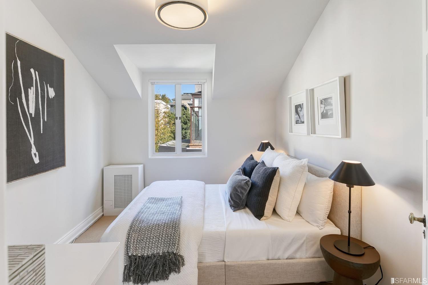 3212 Jackson Street San Francisco, CA 94118 - Photo 27 of 33 a bedroom with a bed and a chandelier