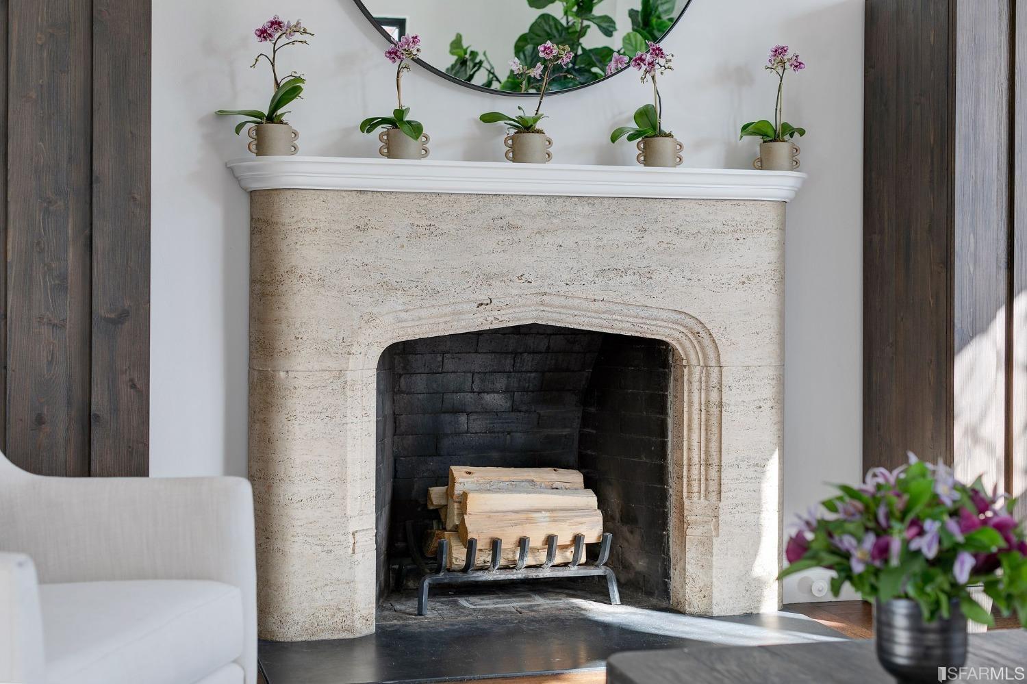 3212 Jackson Street San Francisco, CA 94118 - Photo 7 of 33 a living room with a fireplace and flowers