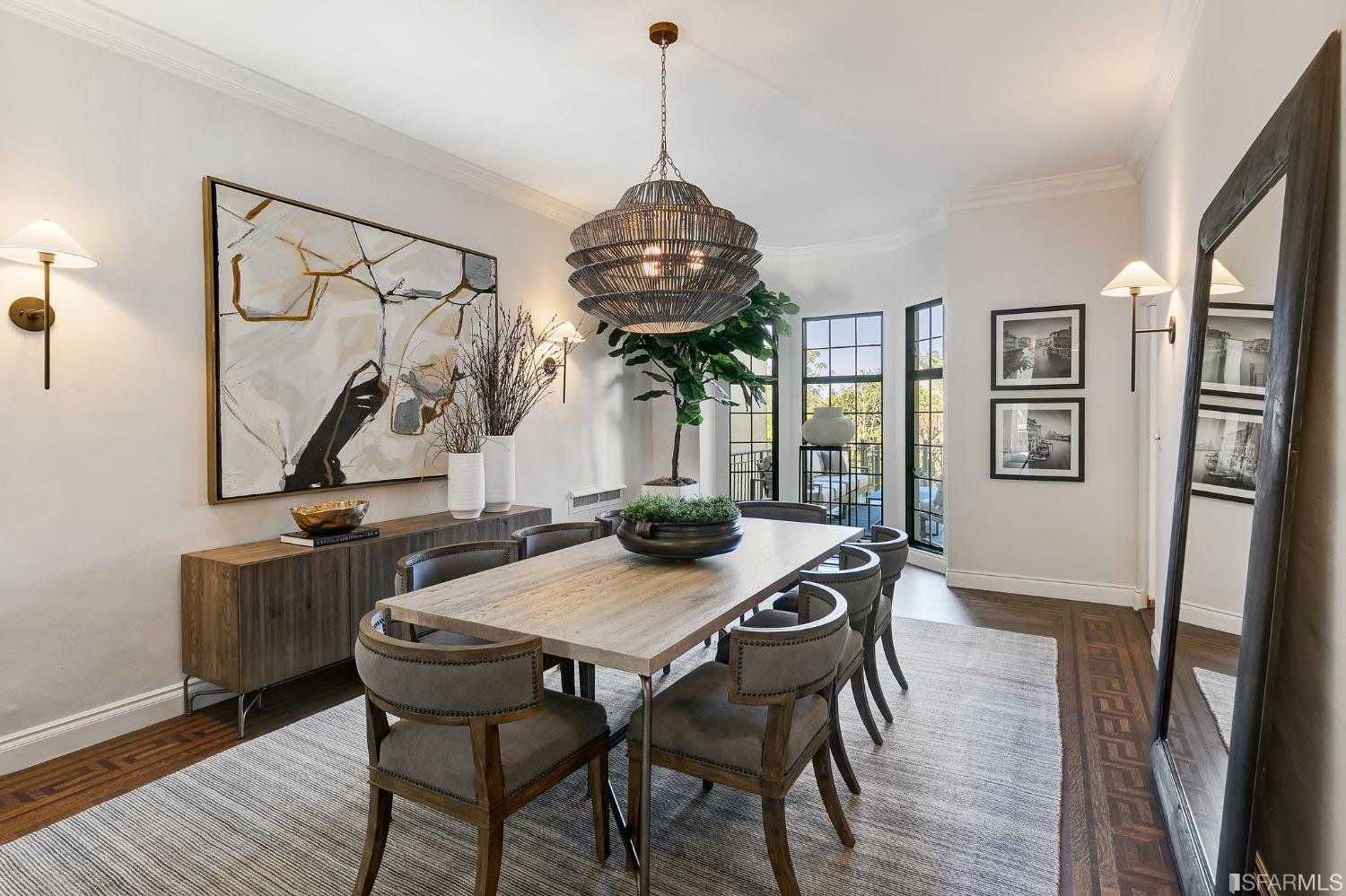 3212 Jackson Street San Francisco, CA 94118 - Photo 8 of 33 a view of a dining room with furniture wooden floor and a chandelier