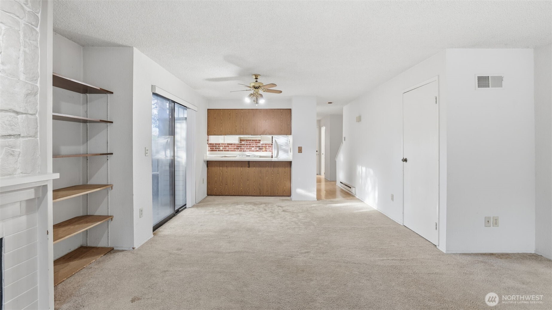 1850 Grant Avenue South, Unit D5 Renton, WA 98055 - Photo 8 of 25 a view of a kitchen with a sink and a refrigerator