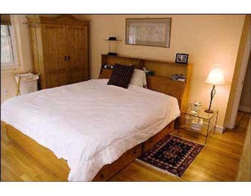 20 Axdell Road Sudbury, MA 01776 - Photo 13 of 17 a bedroom with a bed and wooden floor