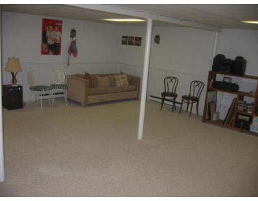 20 Axdell Road Sudbury, MA 01776 - Photo 15 of 17 a living room with furniture and a flat screen tv