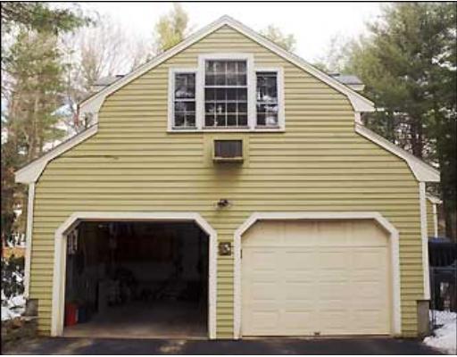 20 Axdell Road Sudbury, MA 01776 - Photo 3 of 17 a front view of a house with garage